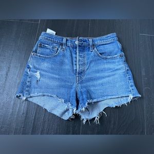Levi's Revolve 501's High Rise
frayed light wash Denim Shorts